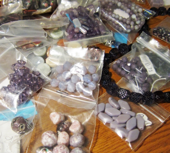 purple beads in ziplock baggies